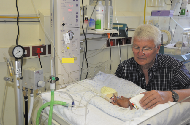 Professor Gert Kirsten, Head Neonatal Division in Tygerberg Children's Hospital and a preterm infant in the Neonatal ward. 